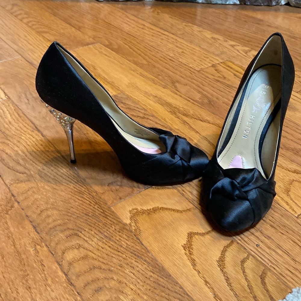 Size 7 black satin heels with rhinestone detail on heel.